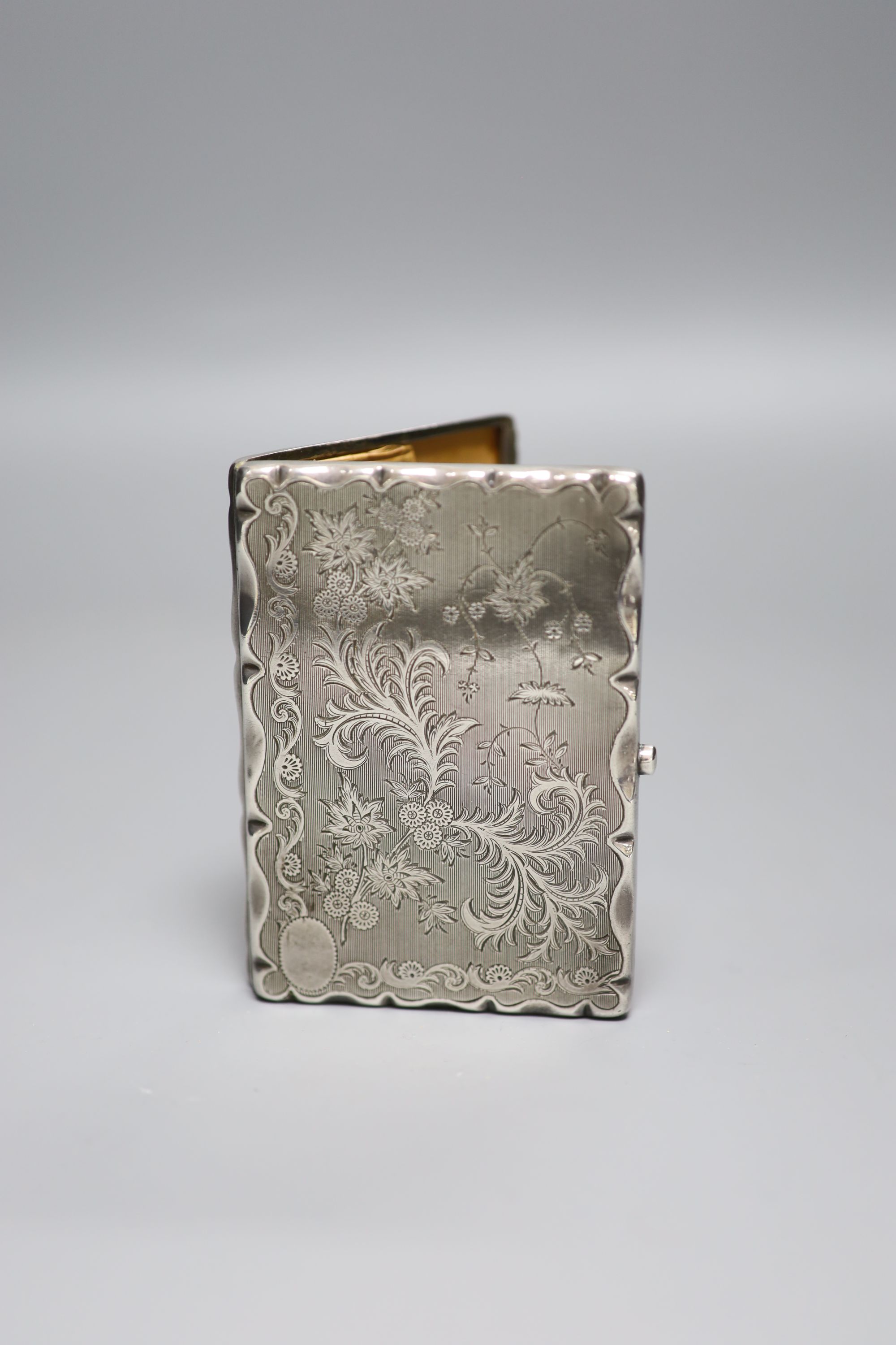 A late Victorian engraved silver card/stamp case, Birmingham, 1890, maker mark rubbed, 10.2cm,